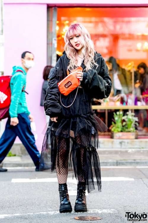 Chamafu on the street in Harajuku wearing a crossbody bag by the Japanese streetwear brand M.Y.O.B. NYC over a Dispark j
