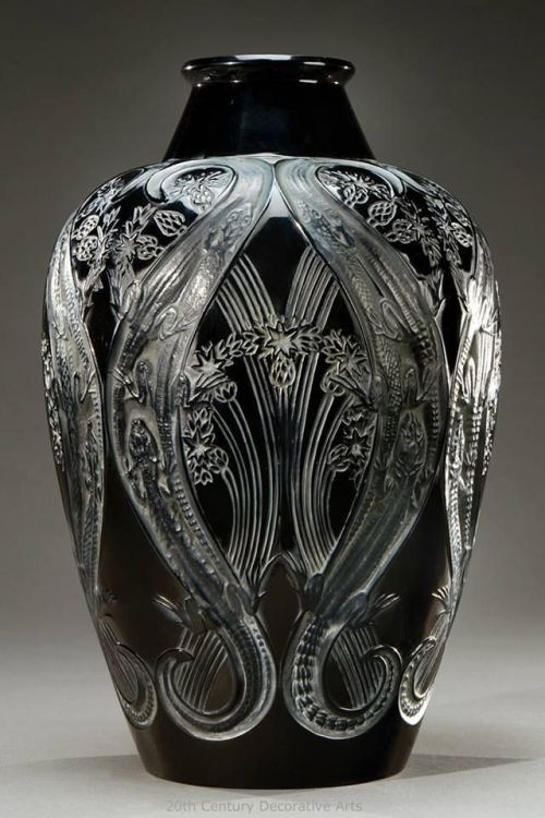 haus-of-glass:  Vase “Lézards et bleuets” (Lizards &amp; Blueberries) 1913 | Blown-molded satin black glass. Signed “R. Lalique”