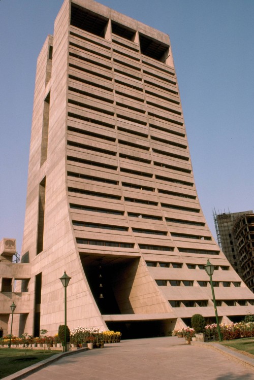 “The sloping sides of Palika Kendra appear as though emerging from the ground, like tectonic plates 