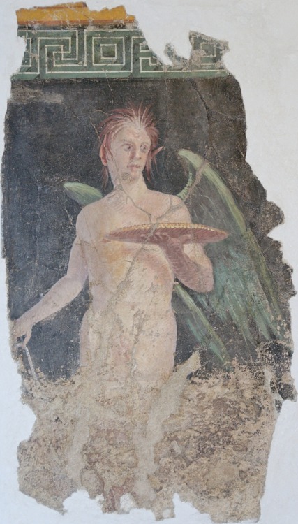 Fragment of an ancient Roman wall painting in the Second Style, depicting a winged genius.  Artist unknown; late 1st cen