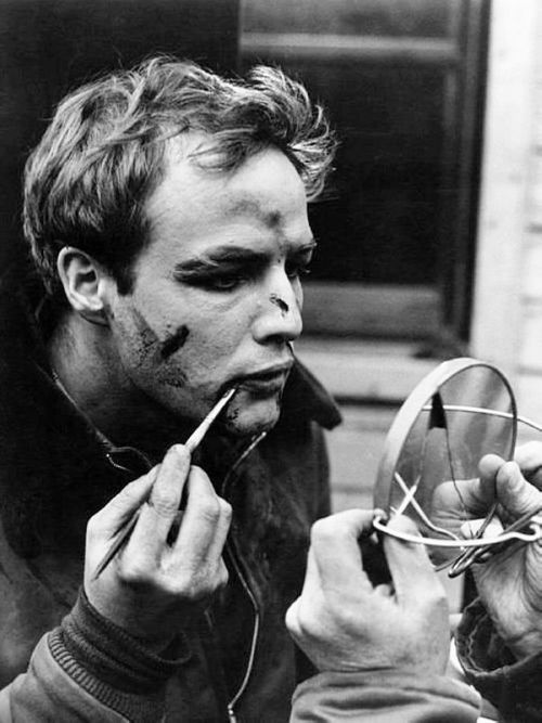 wehadfacesthen:  Marlon Brando applying make-up for a fight scene in On The Waterfront, 1954