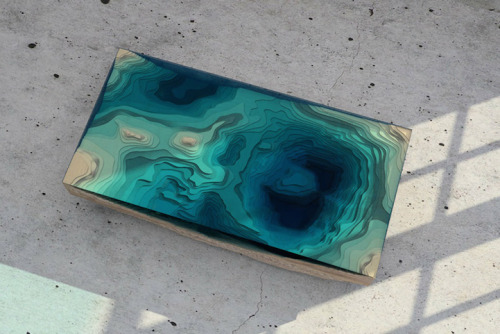 culturenlifestyle:  Stunning Table Displays the Ocean AbyssDesigned by the London based furniture design company Duffy London, the Abyss Table beautifully resembles the ocean’s depth and liquid texture with the aid of wood and sea-foam colored glass.