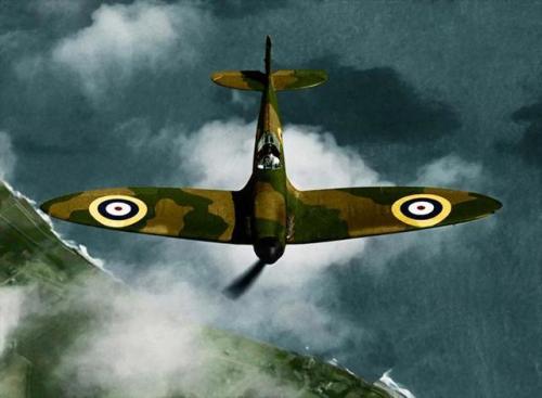 Colourized photos of Spitfire planes during WW2:An RAF Spitfire sails above the clouds on the Britis