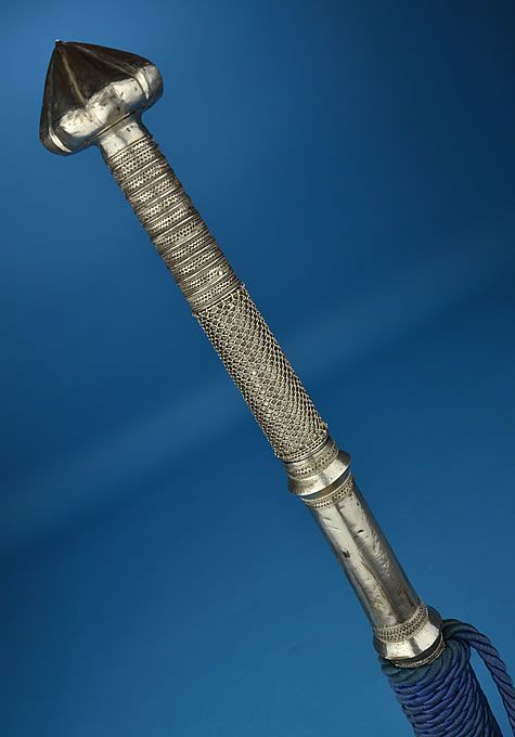 art-of-swords:  Dha SwordDated: circa 1900Place of Origin: Burma or ThailandMeasurements: overall length: 39.5 inches (1000mm); blade length: 24.75 inches (630mm)The long slender hilt is clad in silver featuring silver wire binding. The scabbard is clad