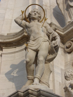 fuckyeahstsebastian:  Budapest, Hungary.  Saint Sebastian, as well as other saints, stand on the pedestal of the Pest Column erected in the Old Town (the Castle).  The town had endured aplague in the early 18th century, and building this column was