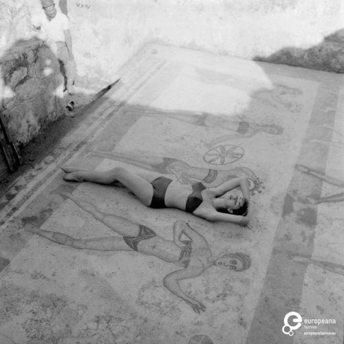 museum-of-artifacts:Model in bikini reclines on the famous ‘bikini girls’ mosaic from the Roman ‘Vil