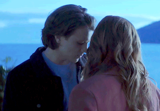 GIF FROM EPISODE 2X18 OF NANCY DREW. NANCY AND ACE ARE STANDING OUTSIDE AT THE BLUFFS. THEY'RE FACE-TO-FACE. THEY LOOK UP AT EACH OTHER AND THEIR FACES ARE VERY CLOSE.