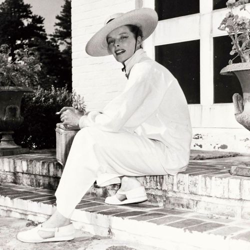 Photographed by Jerome Zerbe, Kate relaxes on Zerbe’s front steps at his Essex Connecticut hom