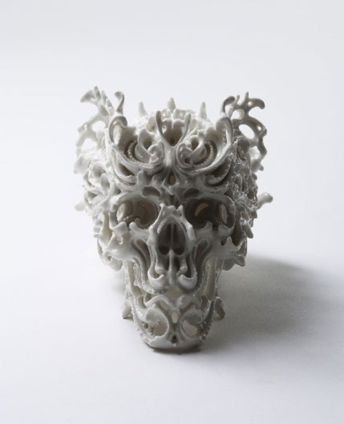 asylum-art:															Beautifully Intricate Porcelain Skulls by Katsuyo Aoki Katsuyo Aoki creates stunningly intricate porcelain skulls. Her work is almost like a three-dimensional expansion on the tradition of calavera, decorated skulls made of sugar