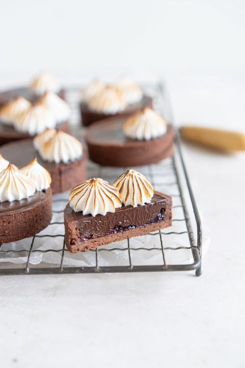 fullcravings:  Dark Chocolate Peanut Butter Mini Tarts with Mixed Berry Jam, Chocolate Crust, and Torched Swiss Meringue