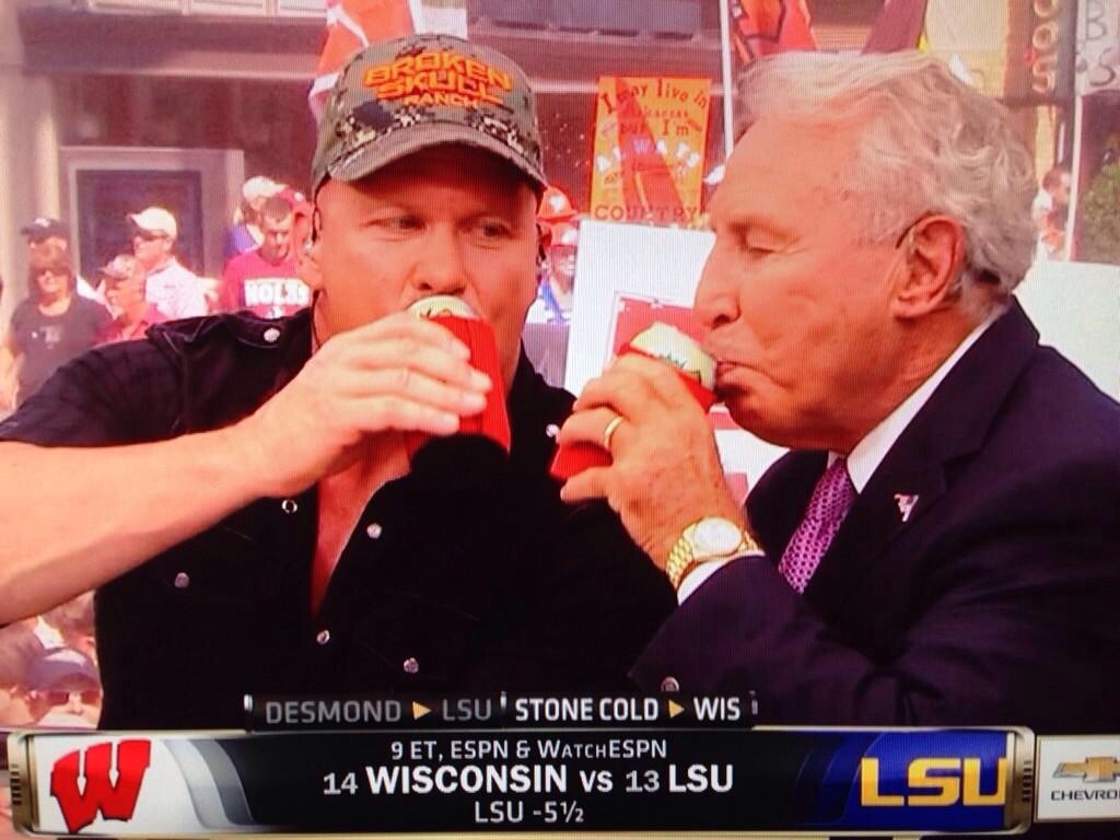 totalfratmove:  Stone Cold Steve Austin and Lee Corso cracking beers on Gameday.