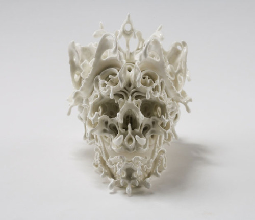 asylum-art:															Beautifully Intricate Porcelain Skulls by Katsuyo Aoki Katsuyo Aoki creates stunningly intricate porcelain skulls. Her work is almost like a three-dimensional expansion on the tradition of calavera, decorated skulls made of sugar