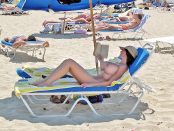big-teen-tits:  Defying gravity at the beach!