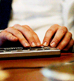 Matt Murdock running his hands over a screen reader assisted by Braille display