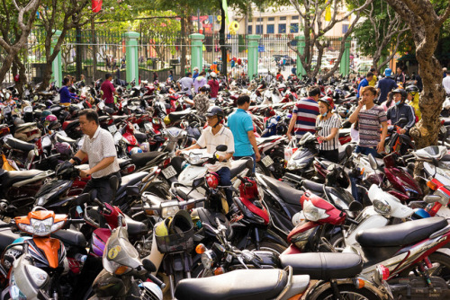 Pretty full scooter parking in Saigon.