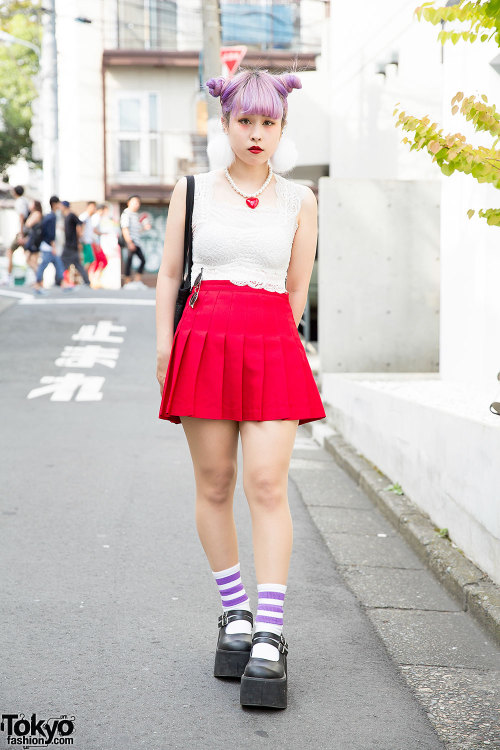 18-year-old fashion school student Serina on the street in Harajuku with lilac hair, a lace crop top