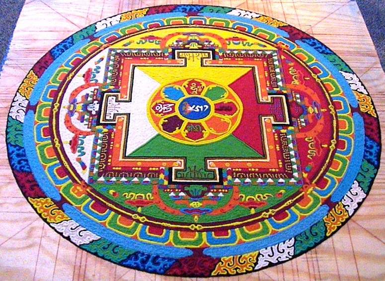 hippiepeacefreaks:  Creation and destruction of mandalas made from colored sand.