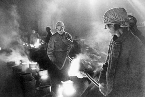 historicaltimes:Metal workers casting iron during the siege of Leningrad, January 1942 via reddit