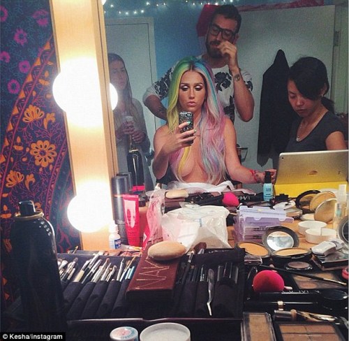 Kesha poses topless in the make-up chair&hellip; before wowing in a plunging gown at MTV VMAs - 
