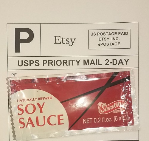 pleasureforge: Shipping label example with some soy sauce to protect our address, and also maybe for