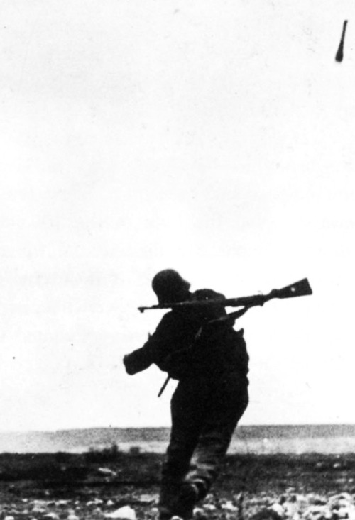 historyfuhrer:  A German soldier throwing a stick grenade towards the enemy at Sevastopol, Ukraine 1