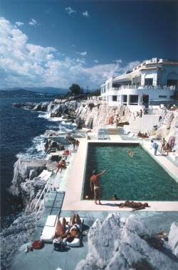 sarahthuresson:  Guests by the pool at the Hotel du Cap-Eden Roc, Antibes, France - Slim Aarons (1976) 