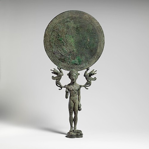 ancientpeoples: Bronze mirror The mirror is supported by a naked girl. She is standing on a curled u