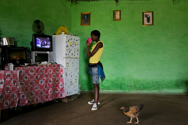 Phelokazi Madlamini, 14, watched the burial service of former South African President Nelson Mandela on television at a home near Qunu (Photo by Todd Heisler/NYT)
