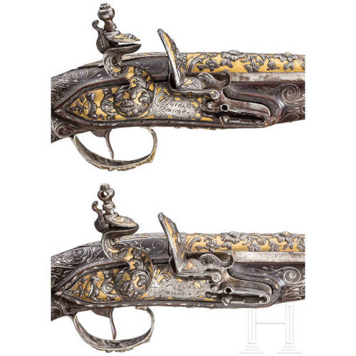 A pair of chiseled, gold and silver inlaid flintlock pistols crafted in France, circa 1810-1820.from