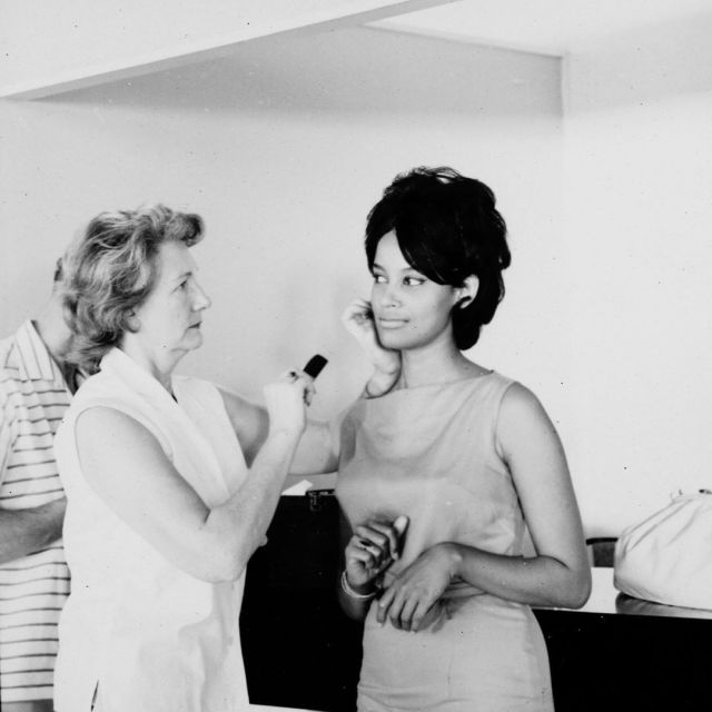 Marguerite LeWars getting her makeup done during production of 