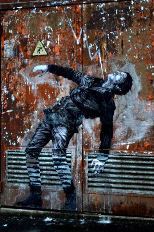 itsderandom:The French street artist known as Levalet, aka Charles Leval, works in Paris filling con