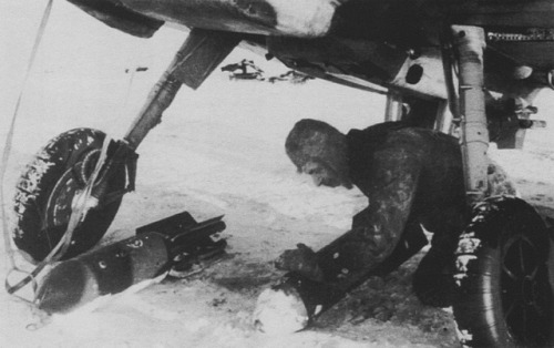 Bombs are getting put on Bf.109F-4B in 19341