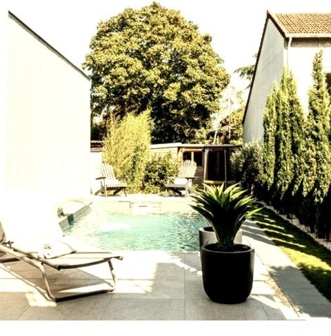 Landscape - Modern LandscapeDesign Ideas For A Mid-sized Modern Partial Sun Backyard Stone Water Fountain