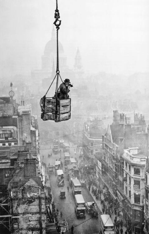 undr:Fox PhotosFox photographer and daredevil R J Salmon dangles in a crate suspended from a crane t