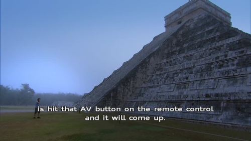 wenchyfloozymoo: Karl explaining how to play a DVD to Suzanne while at the Chichen Itza.