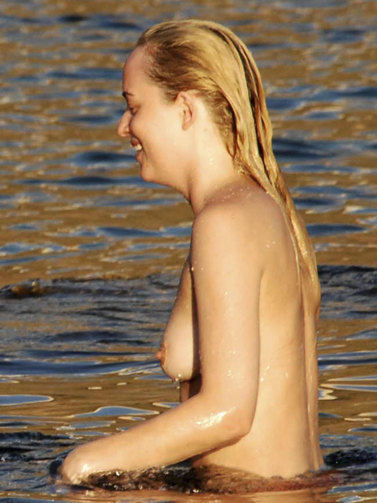 toplessbeachcelebs:Dakota JohnsonÂ swimming topless in Pantelleria, ItalyÂ (October
