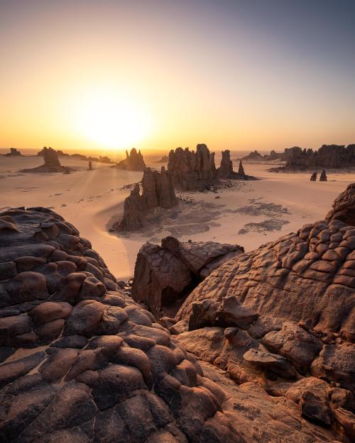 amazinglybeautifulphotography:Desert sunrise landscape, Tahaggart, Algeria [OC] [1600x2000] - Author
