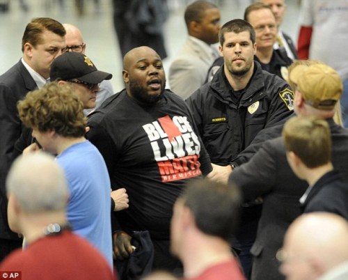 apachelastwords:  thingstolovefor:    A #BlackLivesMatter activist was hit, kicked and pushed to the ground at a Donald Trump rally  At least a half-dozen attendees shoved and tackled the protester, a black man, to the ground as he refused to leave the