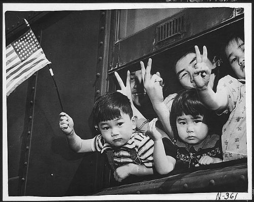 historicaltimes:A group of Japanese-American residents of Bainbridge Island, WA, wave the American f