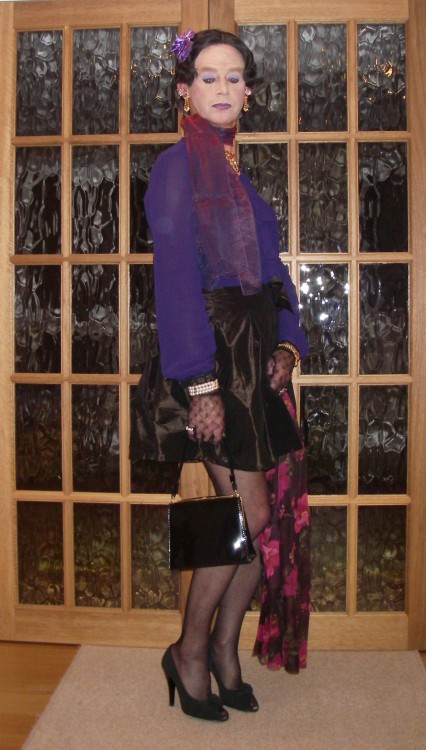 Purple chiffon blouse and satin mini-skirt. The skirt has a pretty bow on the waist. I love my chiff