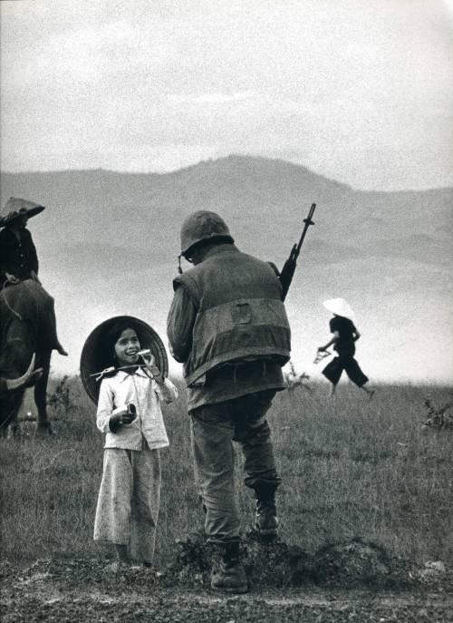 error888:A solider chats with a young country girl. Vietnam, c.1967 by Philip Jones Griffith [1697 x