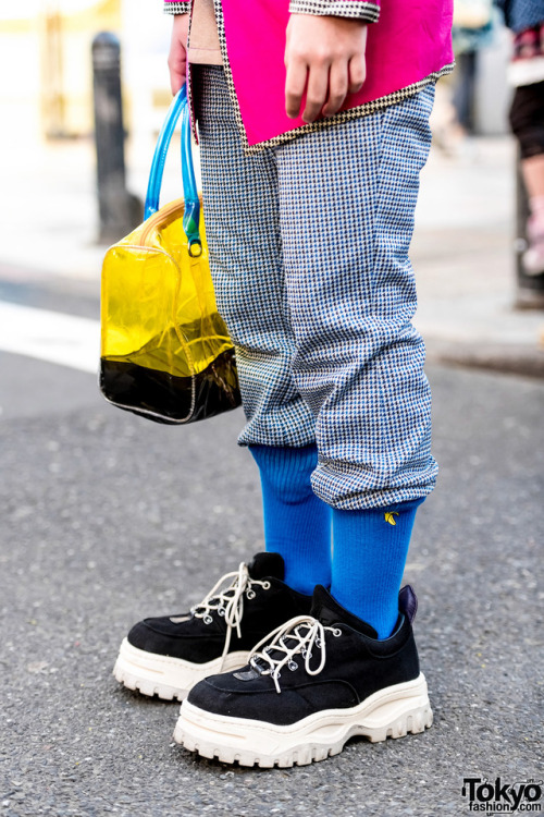 16-year-old Japanese student Taira on the street in Harajuku wearing a black harness over a vintage 