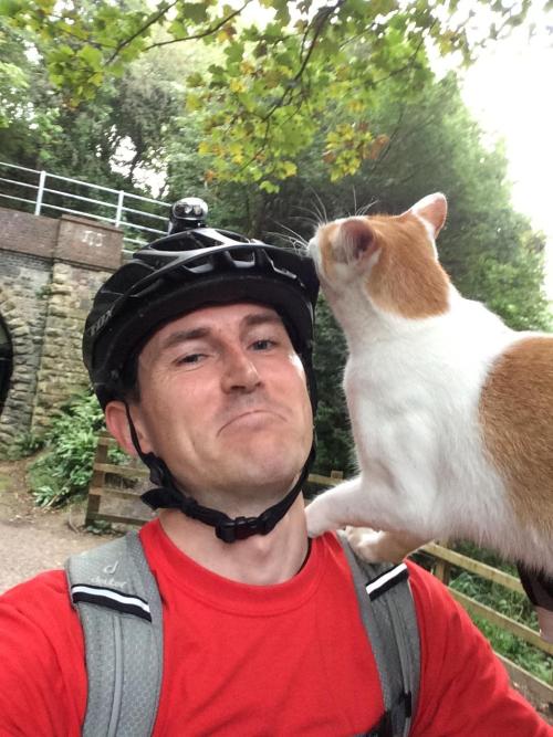 catsbeaversandducks:“When I stopped cycling this cat came out of the woods. I bent down to pet it th