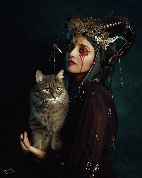 Halloween night…Self portrait with special guest Coco. Super quick shoot, little floof is not
