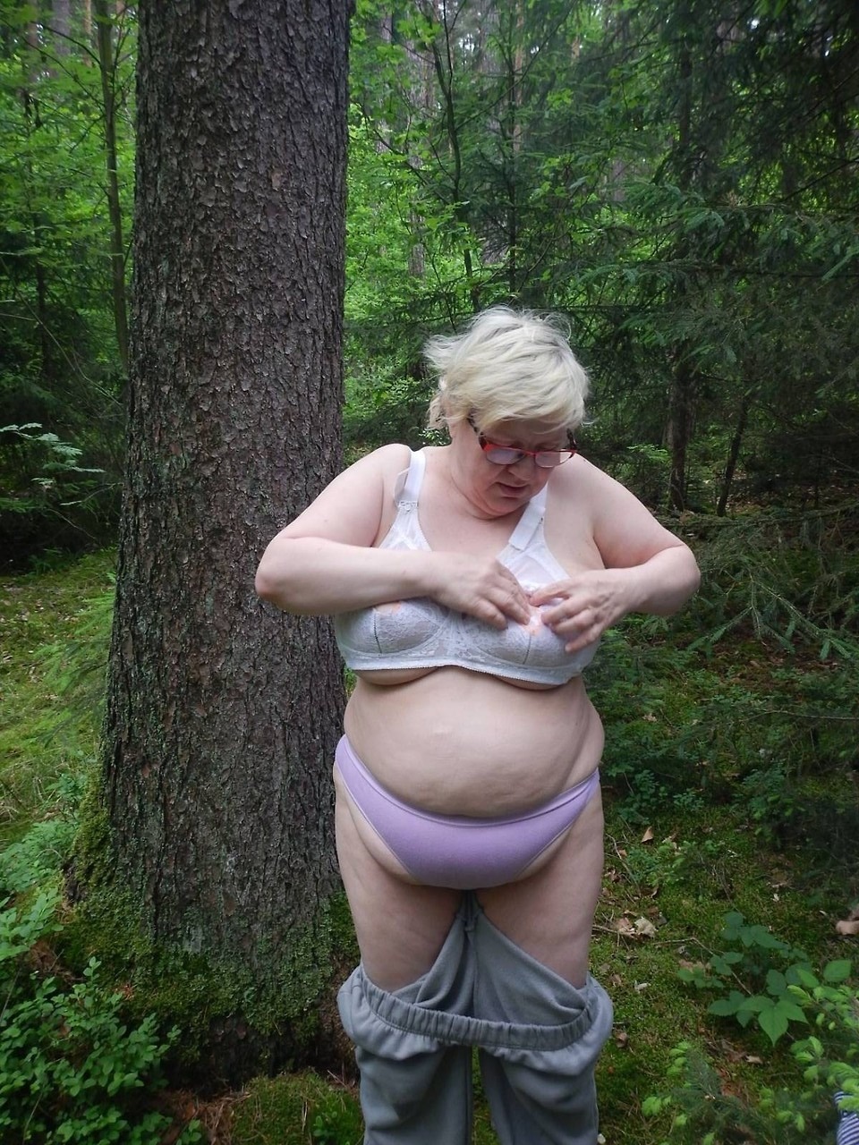 This chubby old granny is undressing in the woods much to our delight. What a big