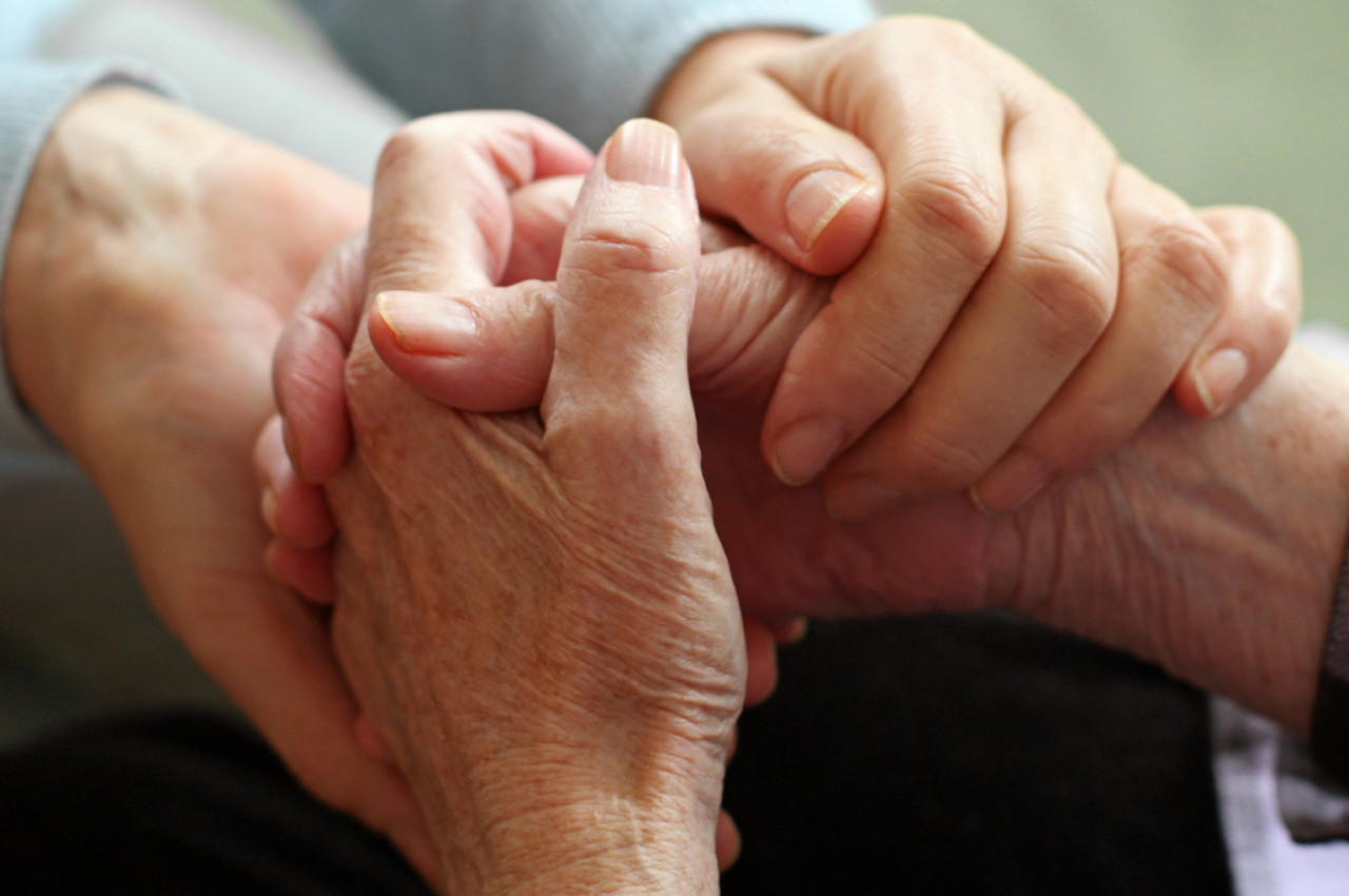 Father and daughter holding hands