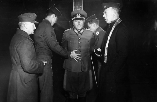 Wehrmacht General Anton Dostler is tied to a stake before hisexecution by firing squad (December 1st