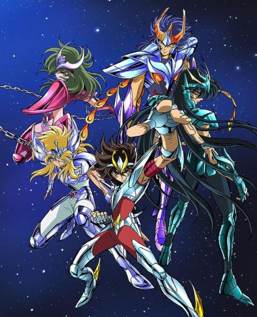 Five men with long hair in colorful armor posing dramatically in outer space. They look like a hair metal band in a space opera about the power rangers.