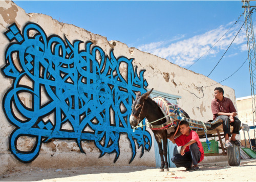 themhworld:El Seed“eL Seed is a ‘calligraffiti’ artist, a blend of the historic art of Arabic callig