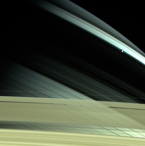 Saturn and Mimas (2004 and 2005) Image credit: NASA/JPL-Caltech/SSI/Kevin M. Gill